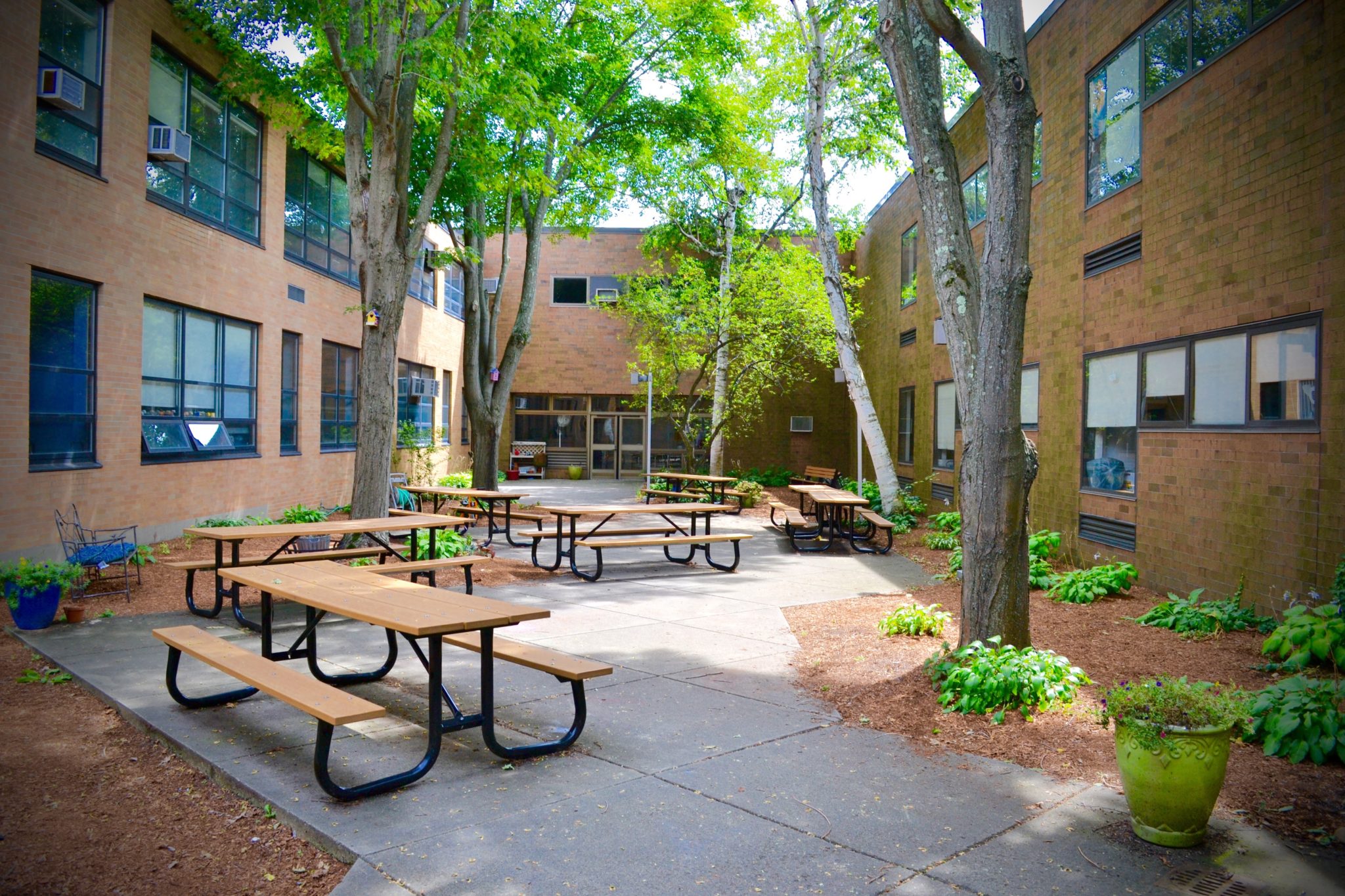 SMS courtyard with tables and landscaping